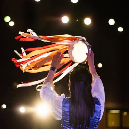 A dancer with colorful ribbons during worship